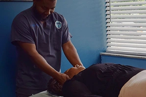 Chiropractic treatment session in progress.